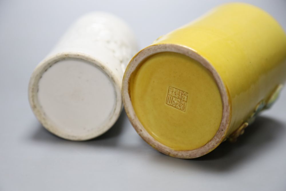 A blanc de chine brush pot together with a Chinese yellow ground brush pot, Qianlong mark but later, height 11cm